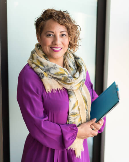 Bookstore manager carries purchasing paperwork